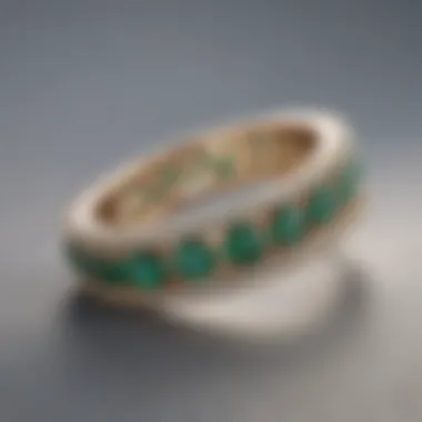 Channel Setting Eternity Band Chic channel setting adorned with sparkling emeralds, displayed with a backdrop of soft lighting to enhance its beauty.
