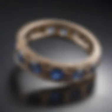 Sleek bezel setting featuring a series of sapphires in a contemporary design, set on a reflective surface.