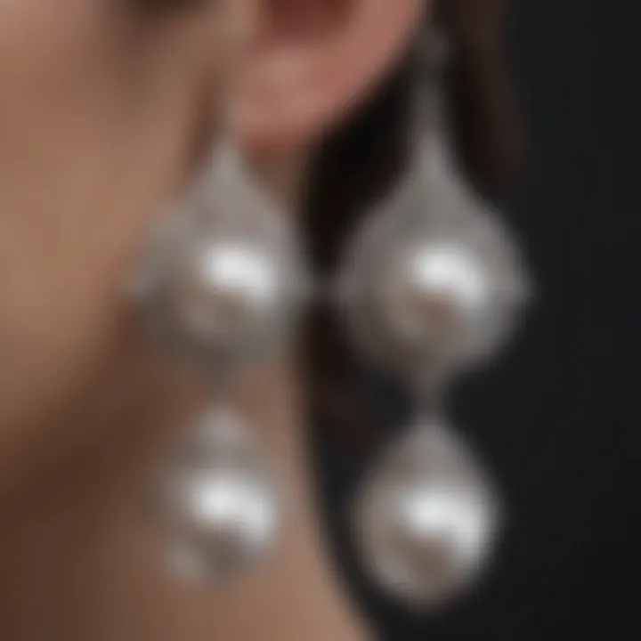 Artistic earrings crafted from silver and pearls