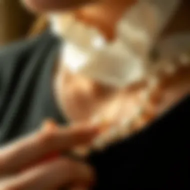 Authenticity Examination Close-up of a person examining a pearl necklace for authenticity