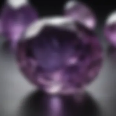 A close-up view of a polished amethyst gemstone reflecting light, highlighting its clarity and brilliance