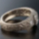 A vintage wedding band showcasing intricate engraving